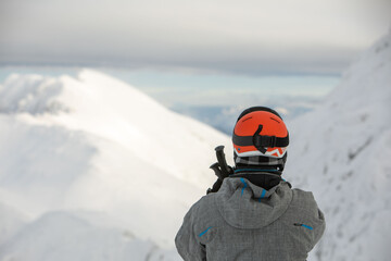 Fototapeta na wymiar man skier enjoying landscape view of winter mountains