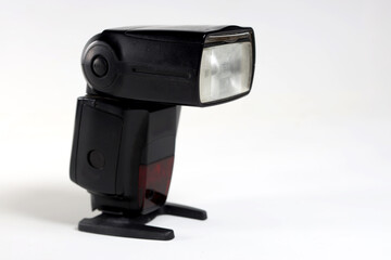 modern flash for low-light photography on a white background