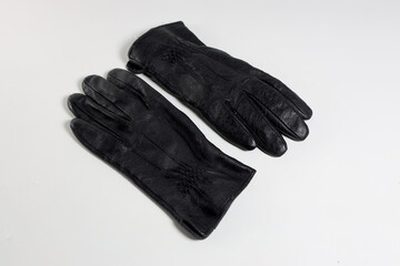stylish leather gloves on a white background