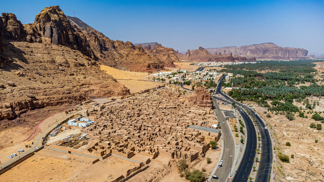 Saudi Arabia, Al-Ula, Aerial view of desert old town with oasis in background