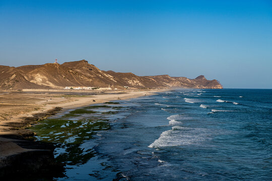 Oman, Dhofar, Salalah, View of Mughsail Beach and blue waters of Arabian Sea