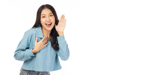 Happy young asian woman try to hearing you overhear listening sound to gossip looking at camera isolated on white background and copy space Studio shot hearing gesture get good news with smile face