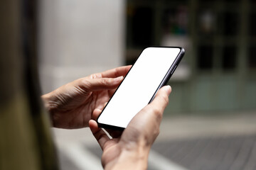 cell phone blank white screen mockup.hand holding texting using mobile on desk at office.background empty space for advertise.work people contact marketing business,technology