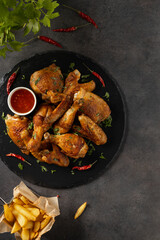 Mix of baked chicken pieces.