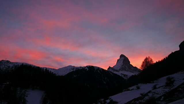 Sunset over the mountains. Landscape of Swiss Alps Matterhorn Glacier in winter. Real time. Zermatt, Switzerland.