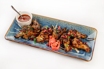 Roasted chicken shins with pomegranate and herbs