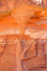 Multi-colored sandstone rock and mineral layers in ancient tombs of Petra, Jordan. Pattern, geological stone texture