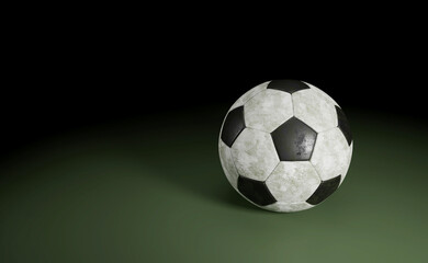 Soccer Ball Isolated on green / Detail of a old black and white soccer ball isolated on green background