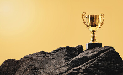 Golden trophy cup on the top of the rock mountain. Business goal and success concept. Champion...
