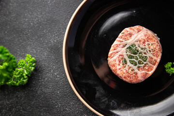 cutlet ground meat in fat grid fatty mesh pork, beef raw minced meat fresh meal snack on the table copy space food background rustic top view