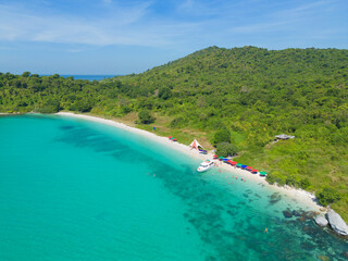 Aerial view of boats with clear blue turquoise seawater, Andaman sea in Phuket island in summer season, Thailand. Water in ocean material pattern texture wallpaper background.