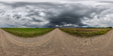 360 seamless hdri panorama view on gravel road before storm with overcast sky and dark cloud in equirectangular spherical projection, ready AR VR virtual reality content