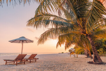 Amazing sunset beach couple chairs sandy beach sea palm. Summer love holiday vacation resort romantic nature. Inspire tropical landscape pattern. Tranquil scene relax beach beautiful honeymoon design