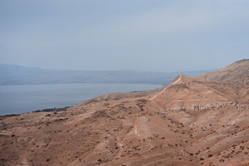 Fototapeta na wymiar Kineret view from national park Hippus - Susita located on the hill on the Golan Heights in northern Israel on the Sea of Galilee. Traveling and hiking outdour nature concept