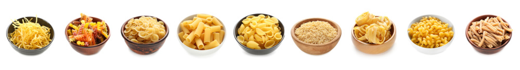 Group of different types of Italian pasta in bowls on white background