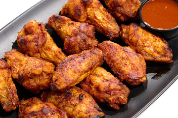 plate with barbecue chicken wings