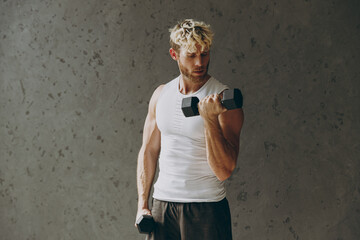 Masculine confident caucasian young strong sporty athletic sportsman man wear white tank shirt...