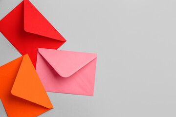 Colorful envelopes on grey background