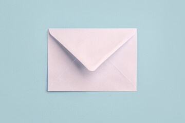 White paper envelope on color background