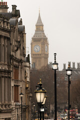 Fototapeta na wymiar Big Ben seen from one of the main streets of London on a cloudy day.