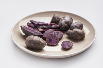 Plate with cut and whole on white background