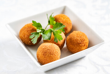 Homemade fried Arancini on the white