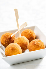 Homemade fried Arancini on the white