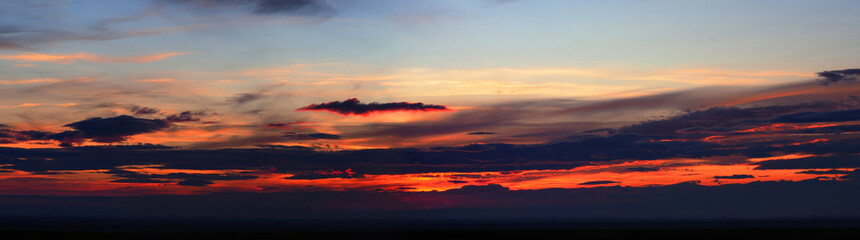 Colorful late sunset with red lava sky, panoramic view