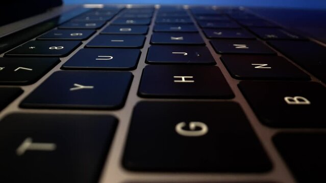 Fingers Working on Laptop Keyboard