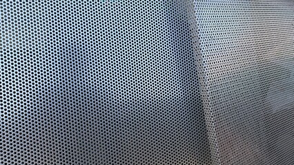 Metal checker plate abstract stainless steel round hole punch for background. 