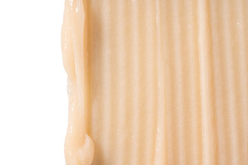 Hair conditioner cream swatch smear on white background. Yellow cosmetic lotion moisturiser sample closeup. Body care balm, retinol serum, shampoo wavy texture. Skincare mask, creamy cleanser product