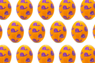 Orange easter egg with a drawing of whales