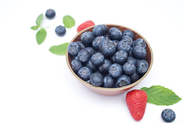 Blueberry on the plate on white background
