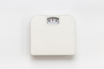 White weight scales on the floor. Weight measurement and loss concept