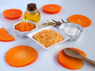 Homemade cosmetic mask of persimmon and rice flour with almond oil