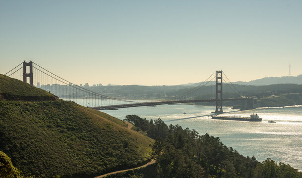 Carge Ship Passing Under Golden Gate Bridge