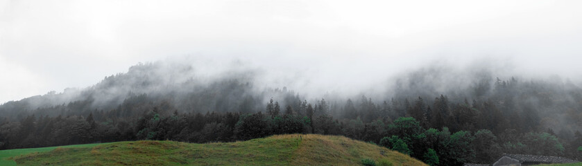 Mountains and hills in the fog after the rain. Banner.