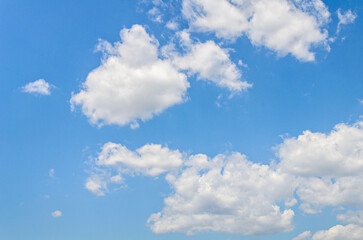 White clouds in a bright blue sky. The beauty of the nature