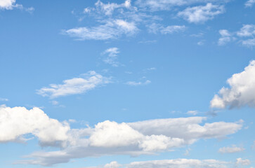 White clouds in a bright blue sky. The beauty of the nature