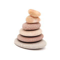 Zen pyramid made of flat pebbled of different colors isolated on white background