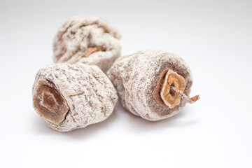 Dried persimmons on white background