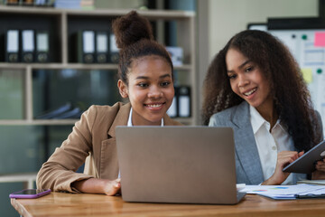 An African American businesswoman participates in a staff meeting and working together at workplace.