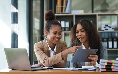 An African American businesswoman participates in a staff meeting and working together at workplace.
