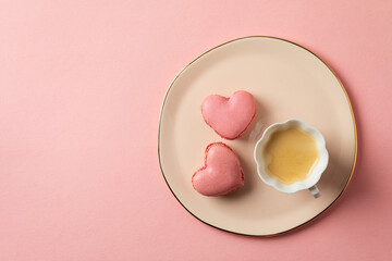 Romantic setup with coffee and heart shaped macarons - 557896704