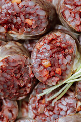 Sundae, Korean Blood Sausage : Pork intestines stuffed with glass noodles, vegetables, sweet rice, coagulated pig's blood (seonji) and steamed. Variations include Ojingeosundae (stuffed squid) and cha