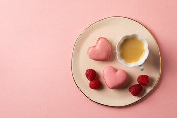 Romantic setup with coffee and heart shaped macarons - 557896921