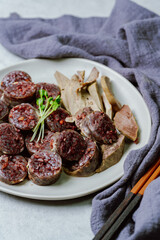 Sundae, Korean Blood Sausage : Pork intestines stuffed with glass noodles, vegetables, sweet rice, coagulated pig's blood (seonji) and steamed. Variations include Ojingeosundae (stuffed squid) and cha