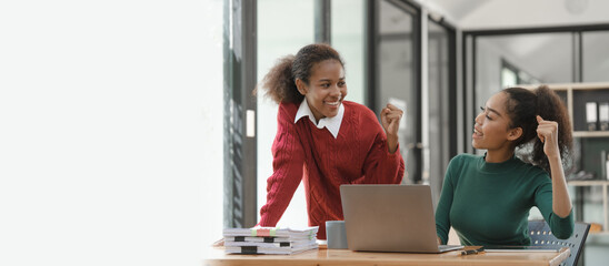 African American girls students studying up for test or making homework together, Back to school concept. Yeh, win, victory