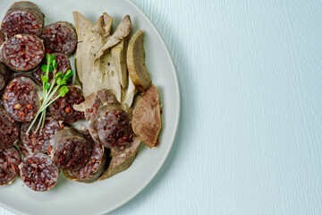 Sundae, Korean Blood Sausage : Pork intestines stuffed with glass noodles, vegetables, sweet rice, coagulated pig's blood (seonji) and steamed. Variations include Ojingeosundae (stuffed squid) and cha