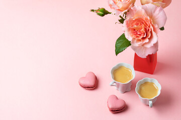 Romantic setup with coffee, macarons and roses - 557897505